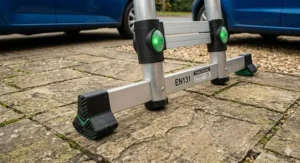 Detailed view of a wide stabiliser bar with heavy-duty rubber feet resting on a flat patio surface for maximum grip.