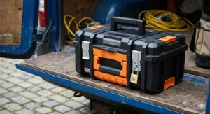 A compact plastic tool box with a sturdy carry handle and metal latches for easy transport.