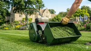 A cylinder mower with a front-mounted grass box collecting clippings to ensure a debris-free striped lawn finish.