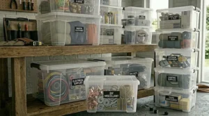 A tidy, decluttered garage space featuring a set of clear stacking boxes for efficient home storage.
