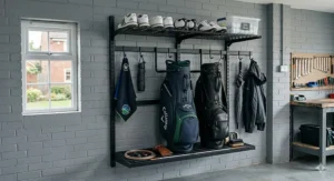 Heavy duty wall mounted golf storage rack holding two premium leather golf bags off the ground to save floor space.