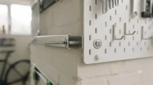 Side-by-side view highlighting the simple screw installation process for a magnetic tool bar compared to a pegboard panel.