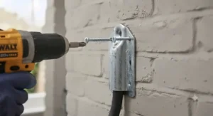 Illustration showing screw installation of a heavy-load wall hook.