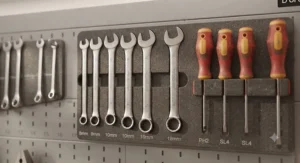 A precision cutting and measuring module wall organiser, keeping tools like hacksaws and tape measures perfectly in place.