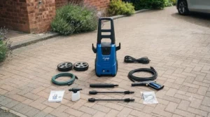 All parts and accessories laid out from an affordable UK car pressure washer box, including the spray gun and hose.