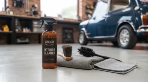Soft-bristled detailing brush and interior cleaner spray for dashboards, air vents, and trim.