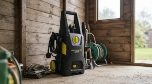 A compact electric pressure washer under £150 neatly stored in a small garden shed alongside other British gardening tools.