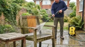 A water-efficient budget pressure washer connected to an outdoor garden tap with a standard hosepipe.