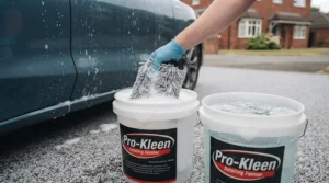 Two wash buckets equipped with grit guards filled with soapy water for a safe car wash.