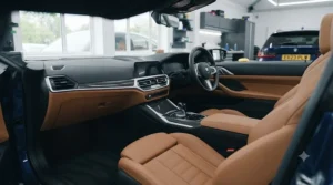 A fully valeted luxury car interior showcasing beautifully cleaned and conditioned leather seats.