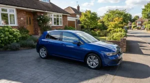 A commuter hatchback protected by ceramic coating for cars parked on a residential driveway in London